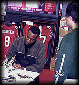 Tony Signs Book For Bull Fans